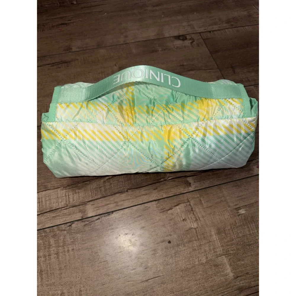 Clinique Quilted Picnic Blanket mint green and yellow plaid carrying strap